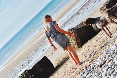 Full length of horse on beach against sky