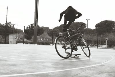 Man riding bicycle on road