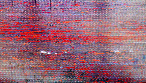 Full frame shot of red brick wall