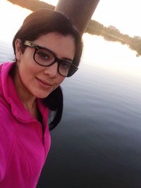 Portrait of young woman in lake