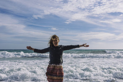 Young woman enjoying at beach