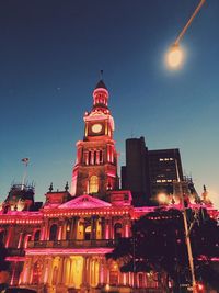 Low angle view of illuminated building at night