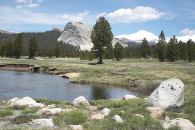Scenic view of lake and mountains against sky