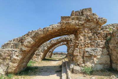 Low angle view of old ruins against clear sky
