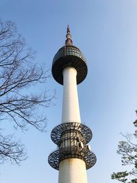 Low angle view of communications tower against sky