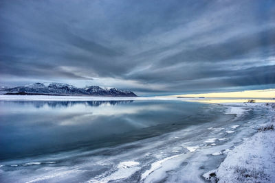 Scenic view of frozen sea against sky