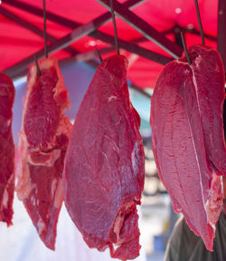 Close-up of fresh red leaves hanging at market stall