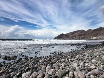 Scenic view of beach against sky