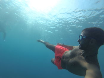 Man swimming in sea