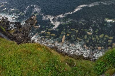 High angle view of rocks by sea