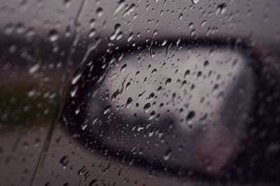 Raindrops on glass window during rainy season