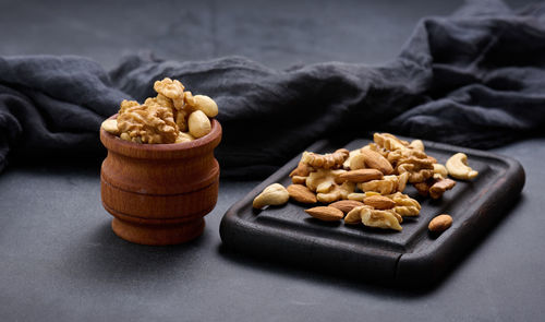 Walnut, almond, cashew on a wooden board. delicious nutritious snack