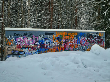 Graffiti on snow covered land