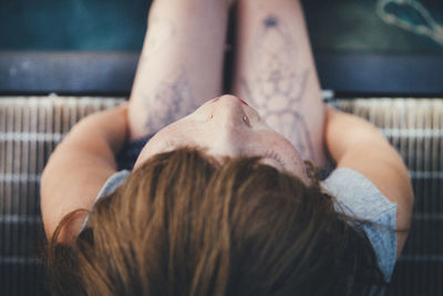 Close-up portrait of woman lying down