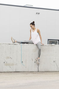 Full length of woman on wall