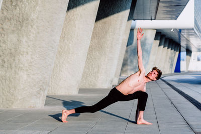 Full length of man skateboarding on wall