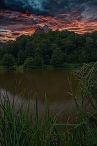 Scenic view of lake against sky during sunset