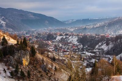 High angle view of buildings in city against sky