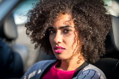 Portrait of woman sitting in car