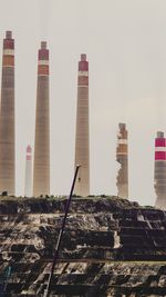 Low angle view of smoke stack against sky