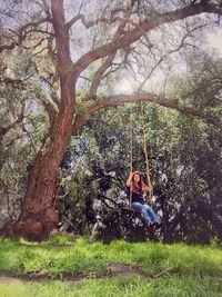 Full length of woman standing on grass