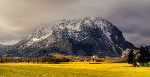 Scenic view of mountains against dramatic sky