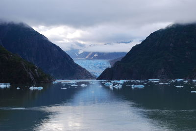 Scenic view of lake and mountains against sky