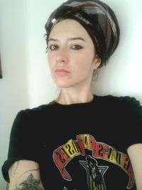 Portrait of beautiful young woman sitting at home