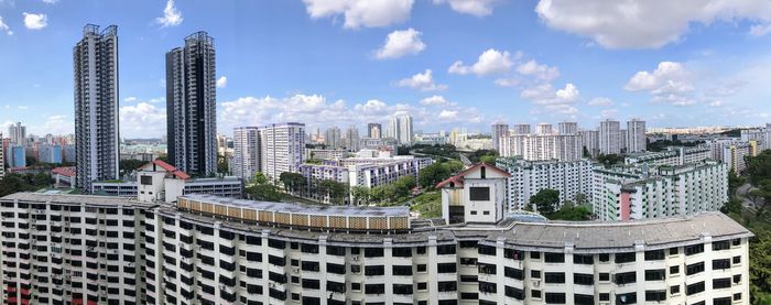 Modern buildings in city against sky