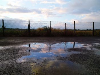 Reflection of trees in lake against sky