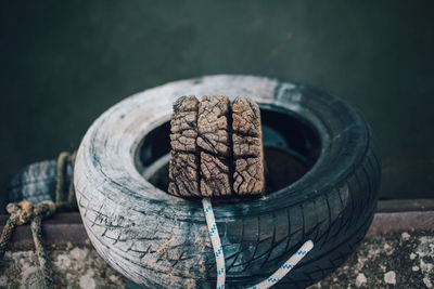 High angle view of weathered wood in tire