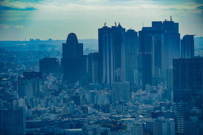 Modern buildings in city against sky