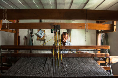 Mature man working in textile industry