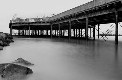 Bridge over sea against sky