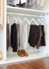 Clothes hanging on rack in store