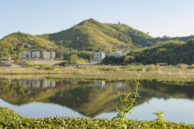 Scenic view of lake and mountains against sky