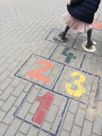 Low section of child on road