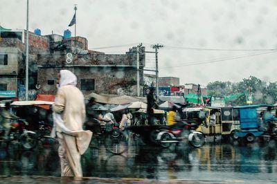 Man looking at city street