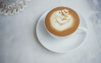 High angle view of cappuccino on table