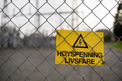 Information sign on chainlink fence