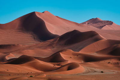 Scenic view of desert against clear sky