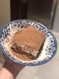 Close-up of hand holding ice cream