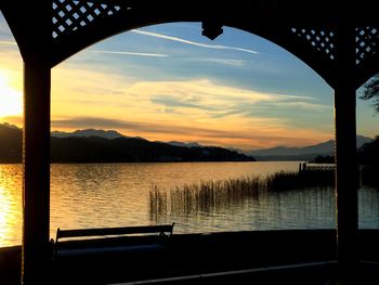 Scenic view of lake against sky during sunset