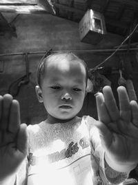 Close-up portrait of cute baby holding boy