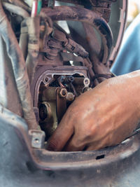 Close-up of man working at garage