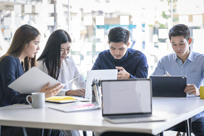 Group of people working on table