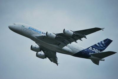 Low angle view of airplane flying in sky