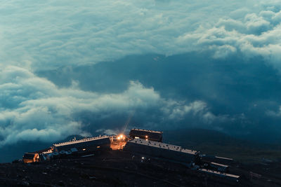 Aerial view of factory against cloudscape