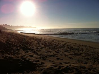 Scenic view of beach at sunset