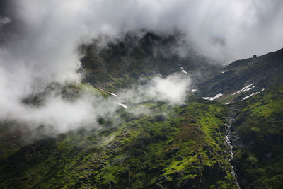 High angle view of mountains amidst fog